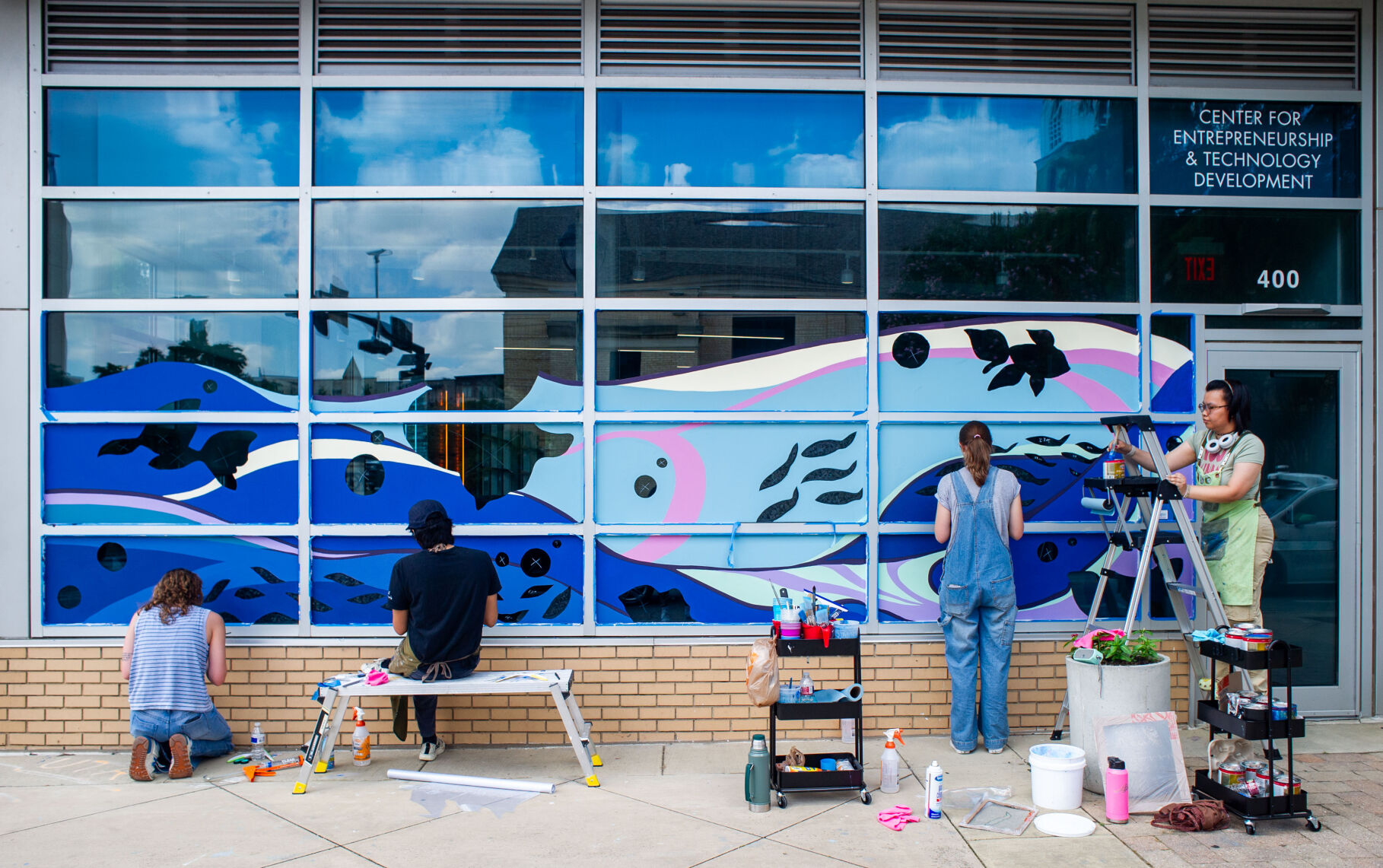 Artist paints new mural at Entrepreneurship and Technology Development Center